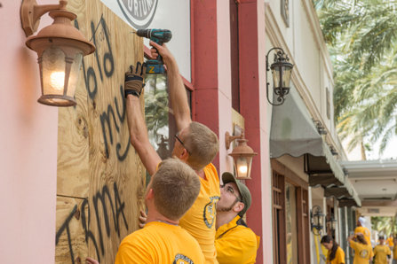 Scientology Volunteer Ministers board up stores in downtown Clearwater before Hurricane Irma