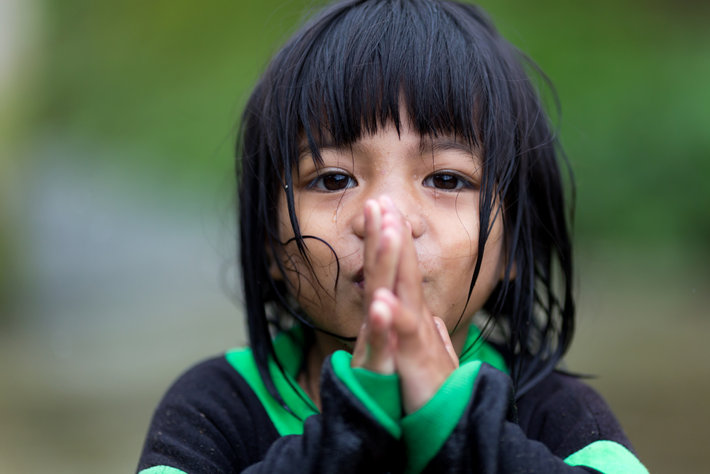 A little Filipino girl prays