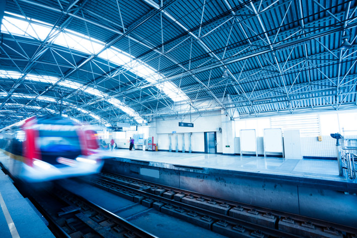 A high-tech train taking off from the station