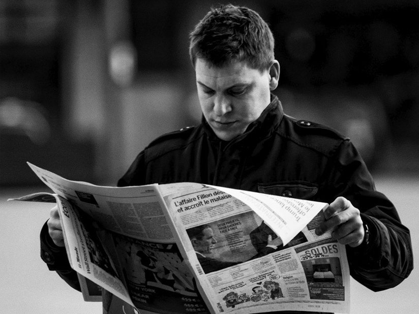 Man reading a newspaper. 