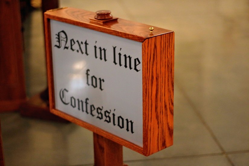 Sign in a church for confession