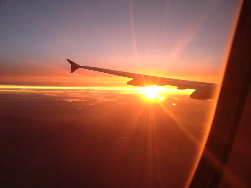 Plane wing at sunset