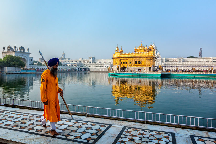 Man walking in front of temple