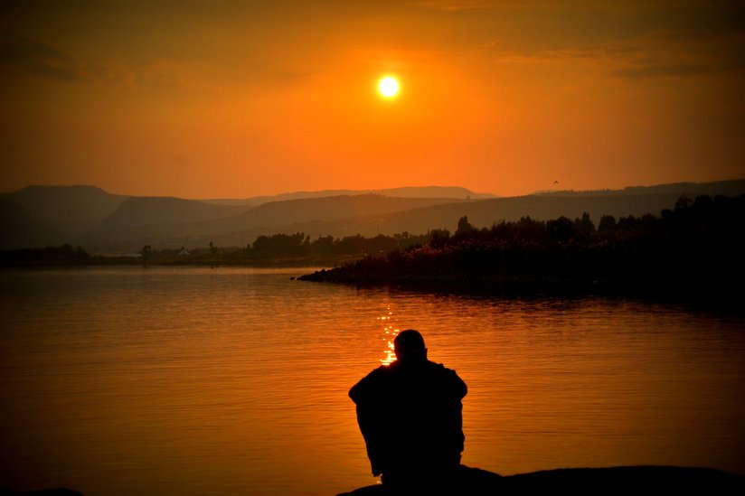 Man’s silhouette looking at the sunset