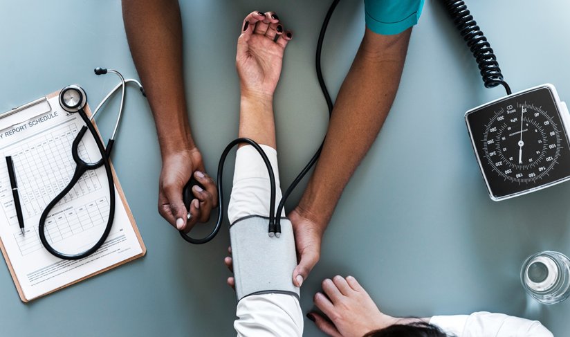 Person having blood pressure checked