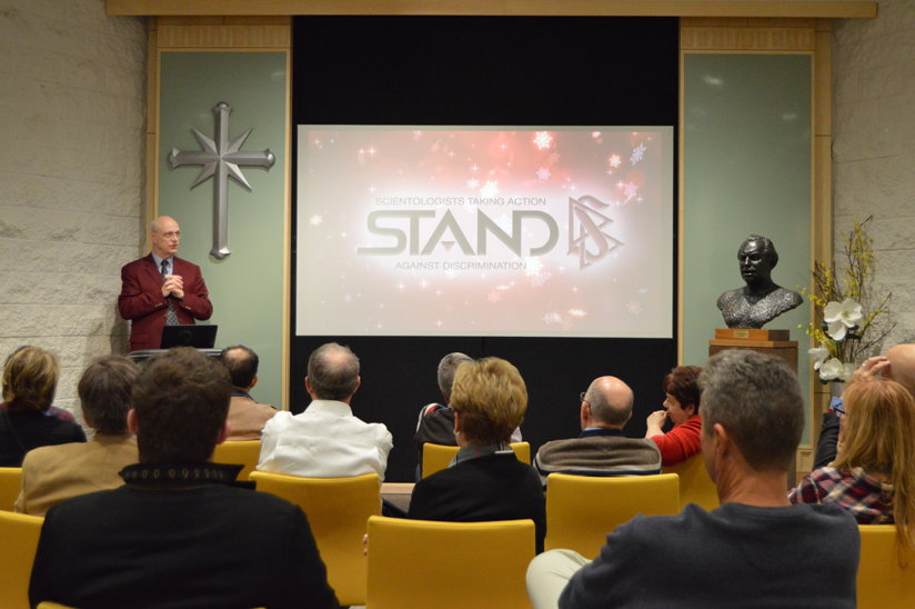 The STAND Director addresses the group