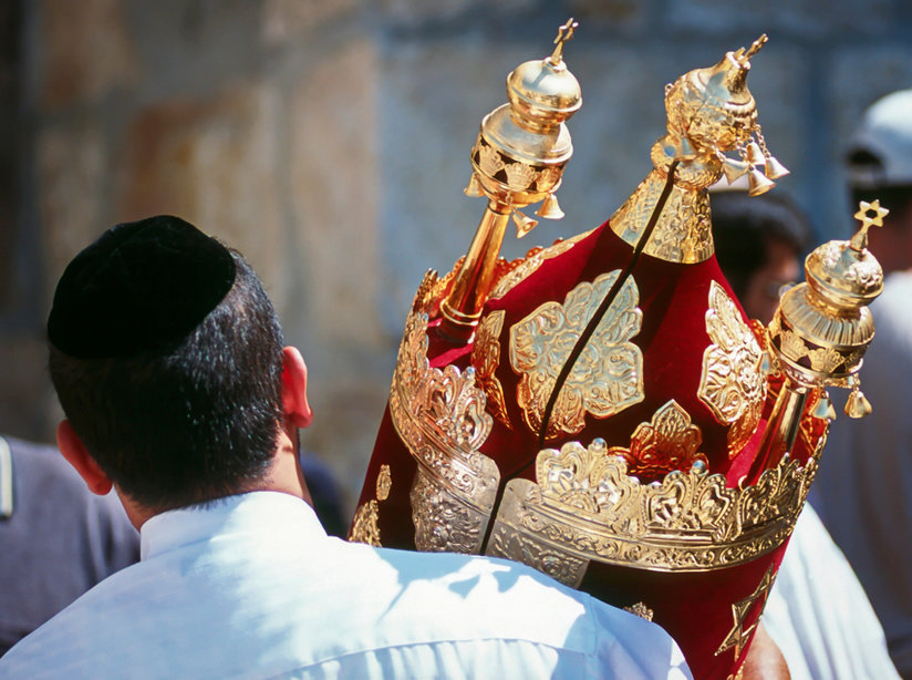 Man carrying Torah scroll